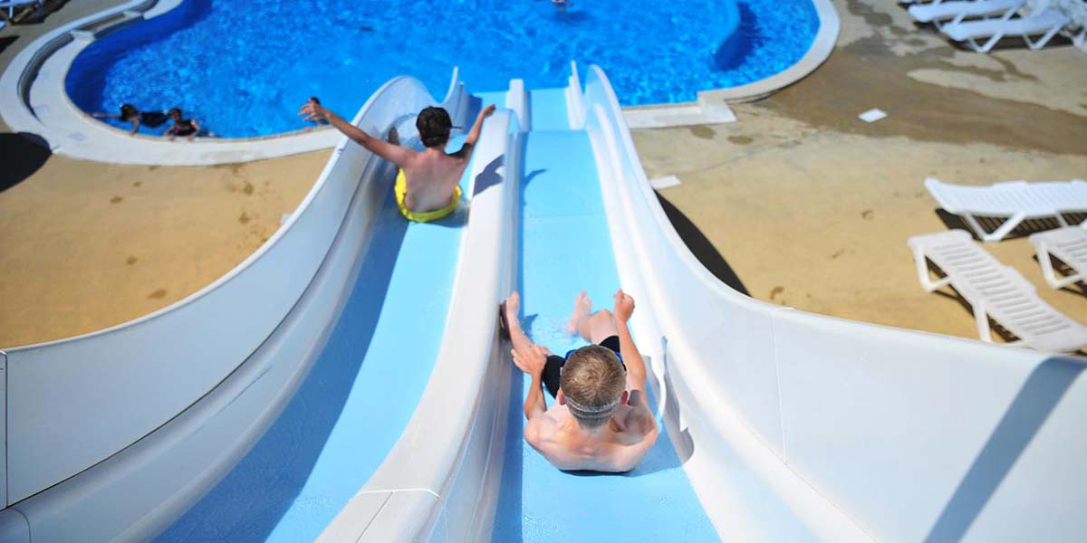 Children on the slides in the aquatic area of the Parc de Bellevue campsite