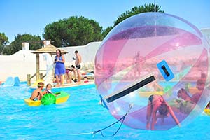 Plastic bubble to play in the aquatic area of the campsite in Arvert