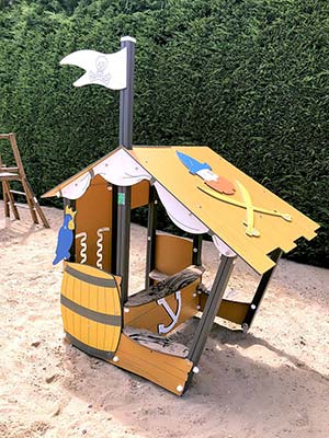 Pirate ship-shaped cabin on the playground at the Bellevue Park campsite