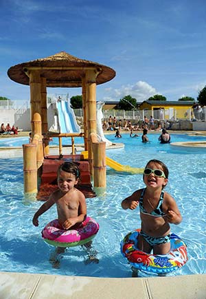 Water slide structure in the heated pool of the campsite