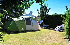 Tent set up on shaded pitch for holidays in Charente-Maritime