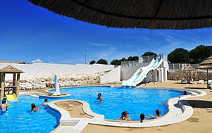 Colorful water slide in the heated pool of the 4-star campsite