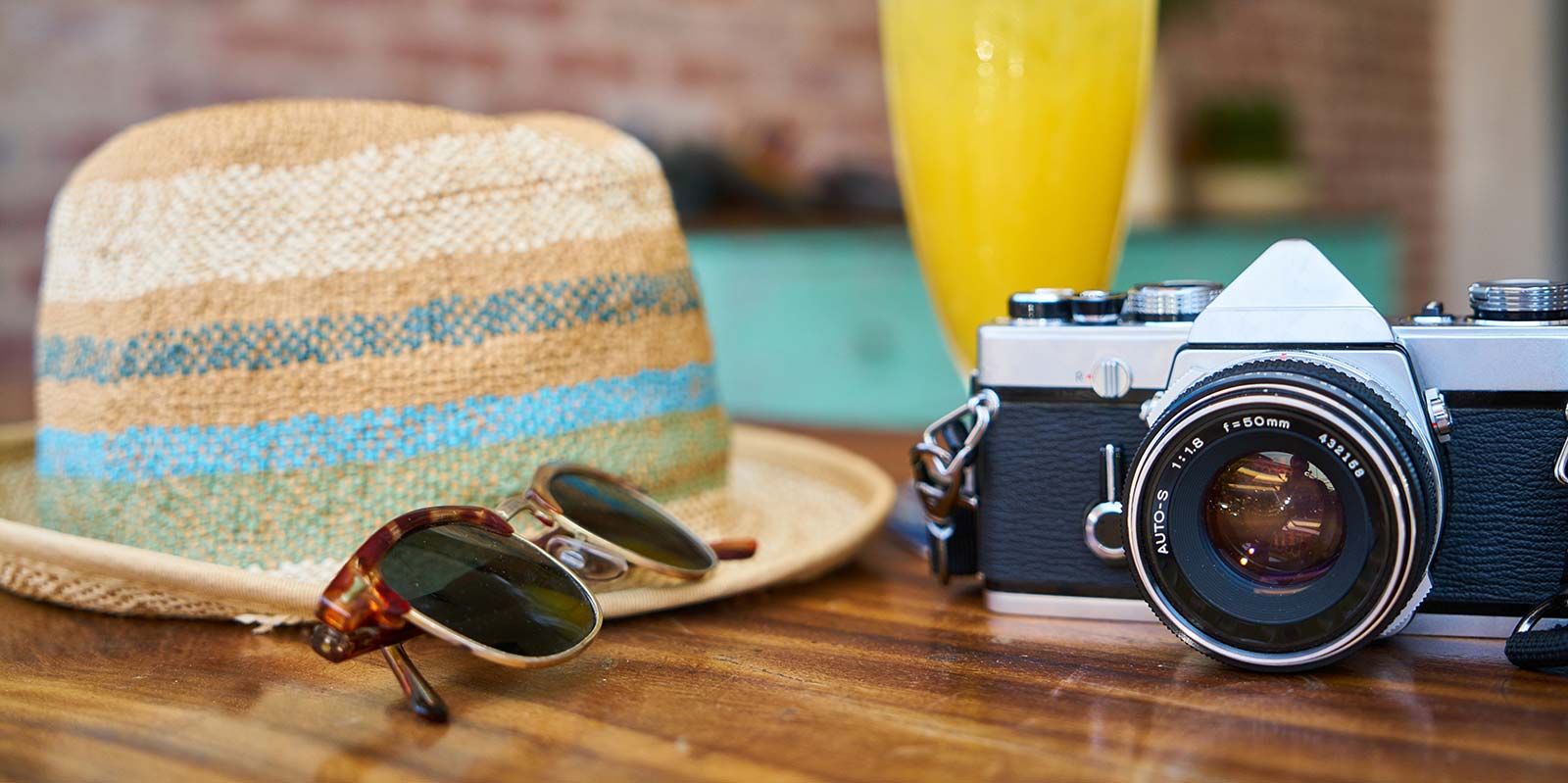 Straw hat and camera at the campsite in Arvert