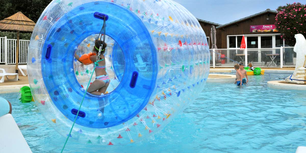 Inflatable aquaroller in the campsite pool in Charente Maritime