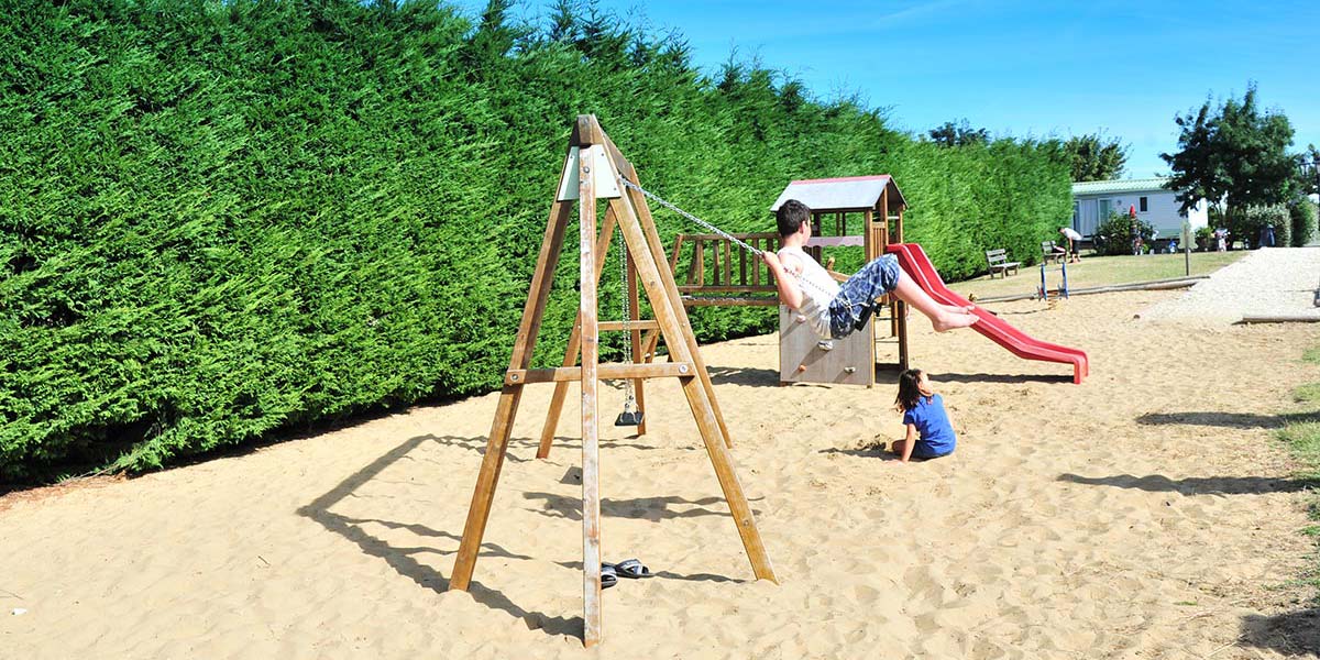 Playground with swing at the campsite near Oléron