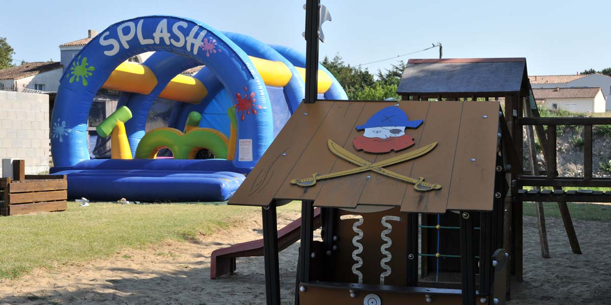 Inflatable games on the play area of the campsite near La Palmyre