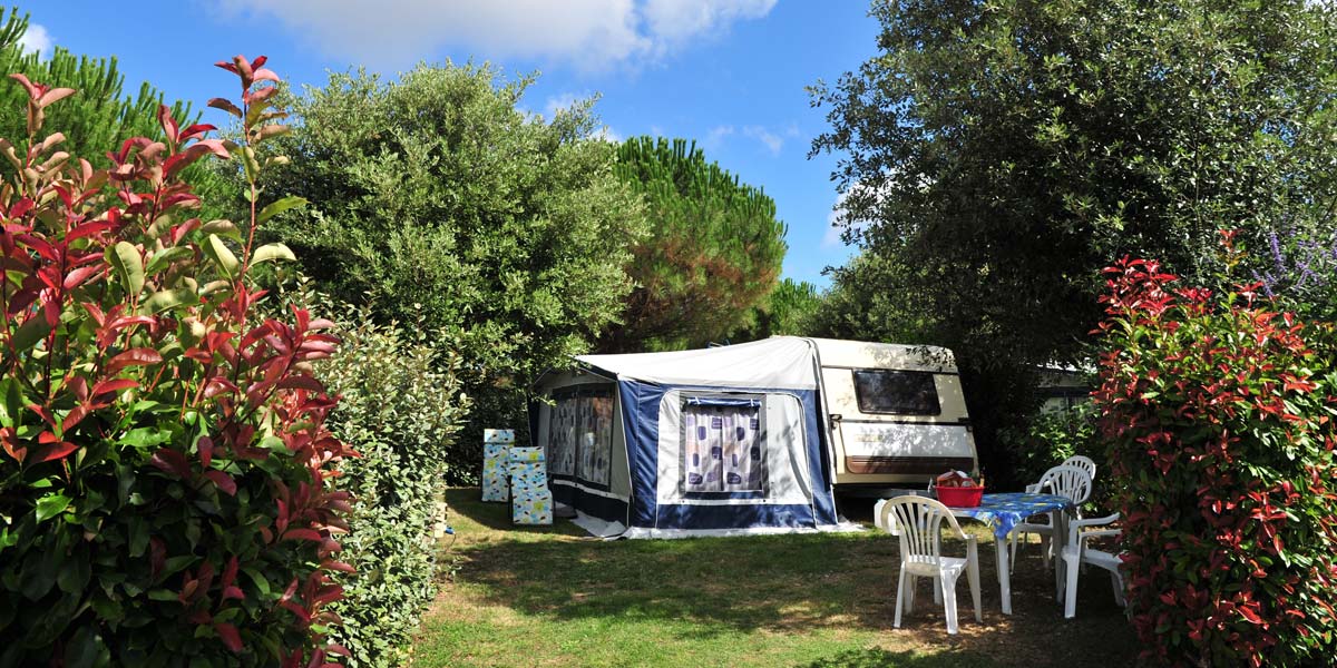 Caravan set up on spacious pitch at the campsite in Charente-Maritime